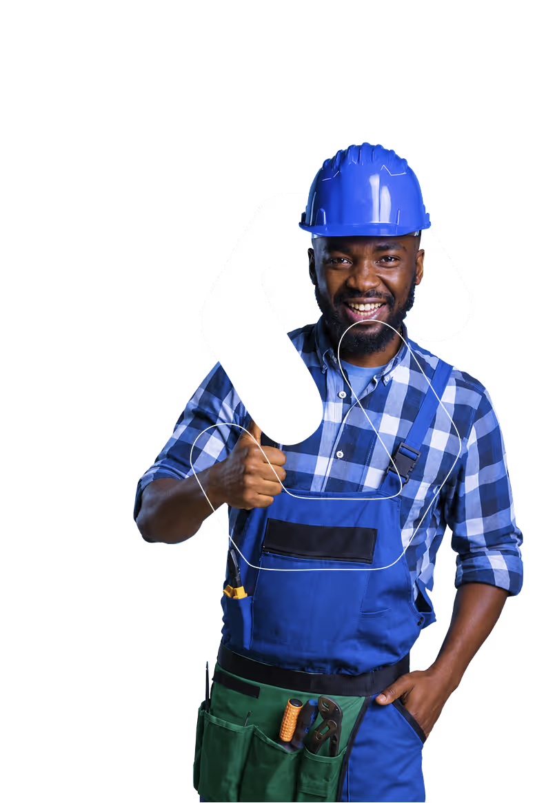 Smiling male construction worker wearing blue helmet and overalls giving thumbs up.